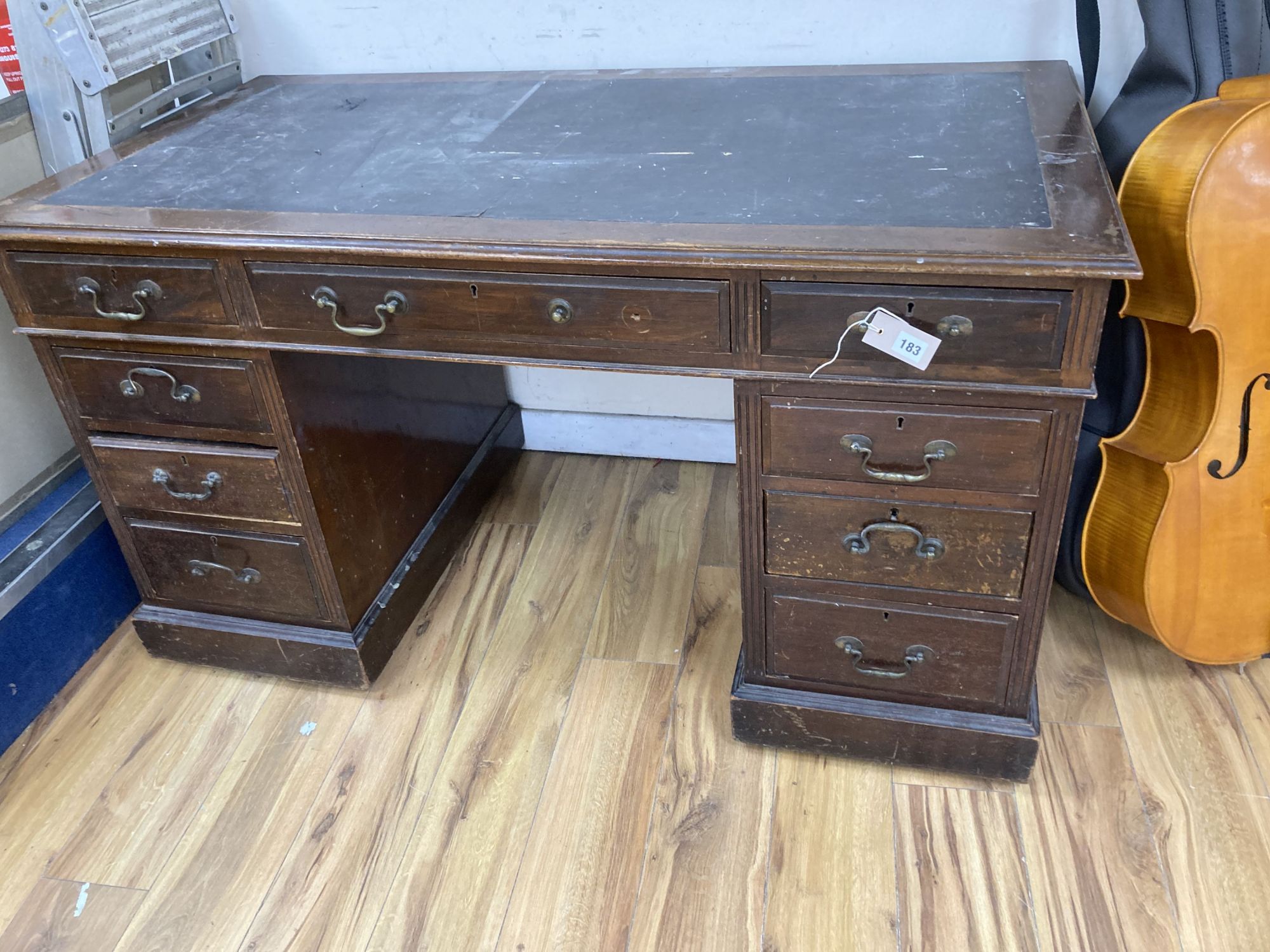 A late Victorian mahogany pedestal desk, length 132cm, depth 73cm, height 77cm